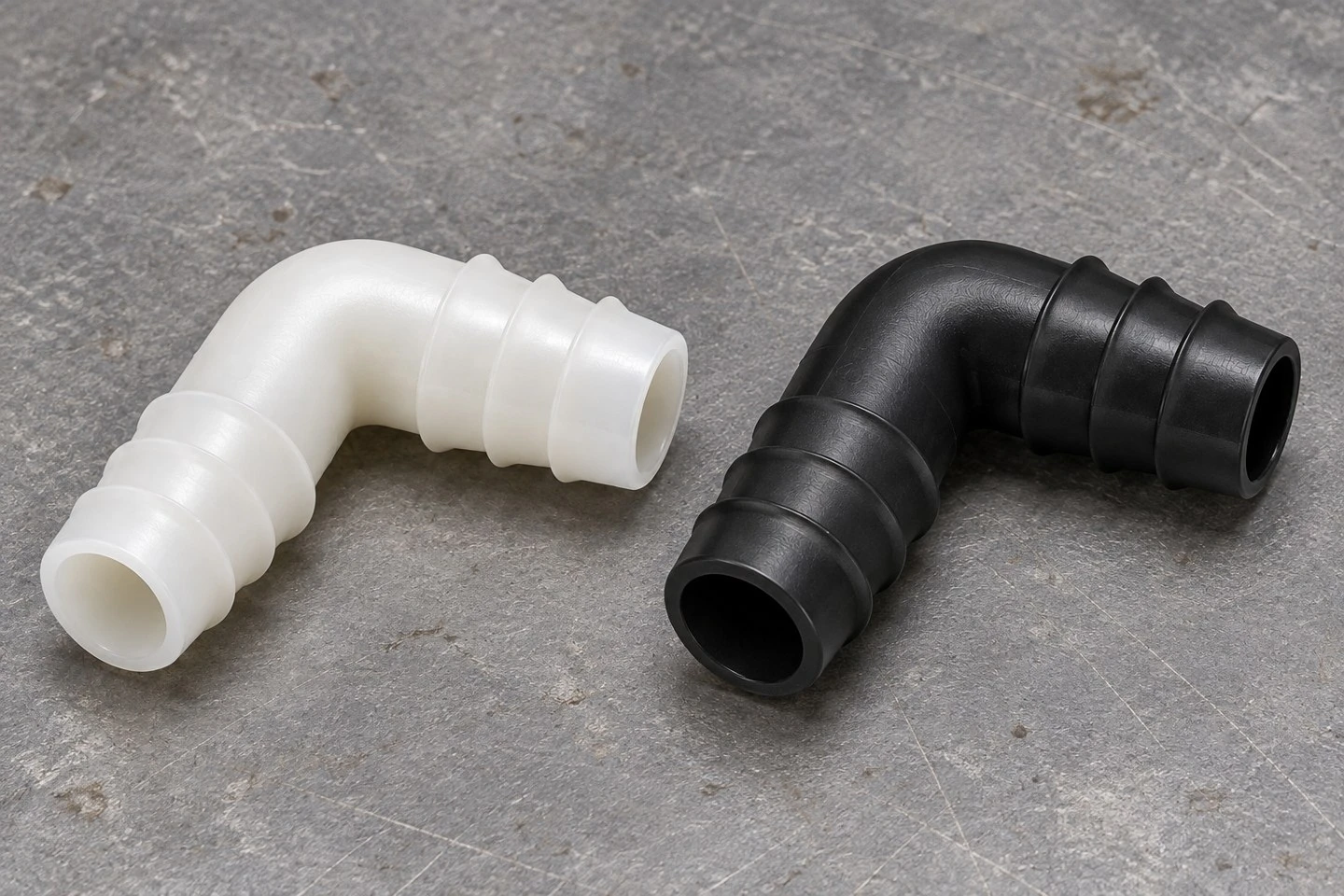 product-1-1 Natural and black custom injection molded PP hose elbow connector concepts with matching barbed tails