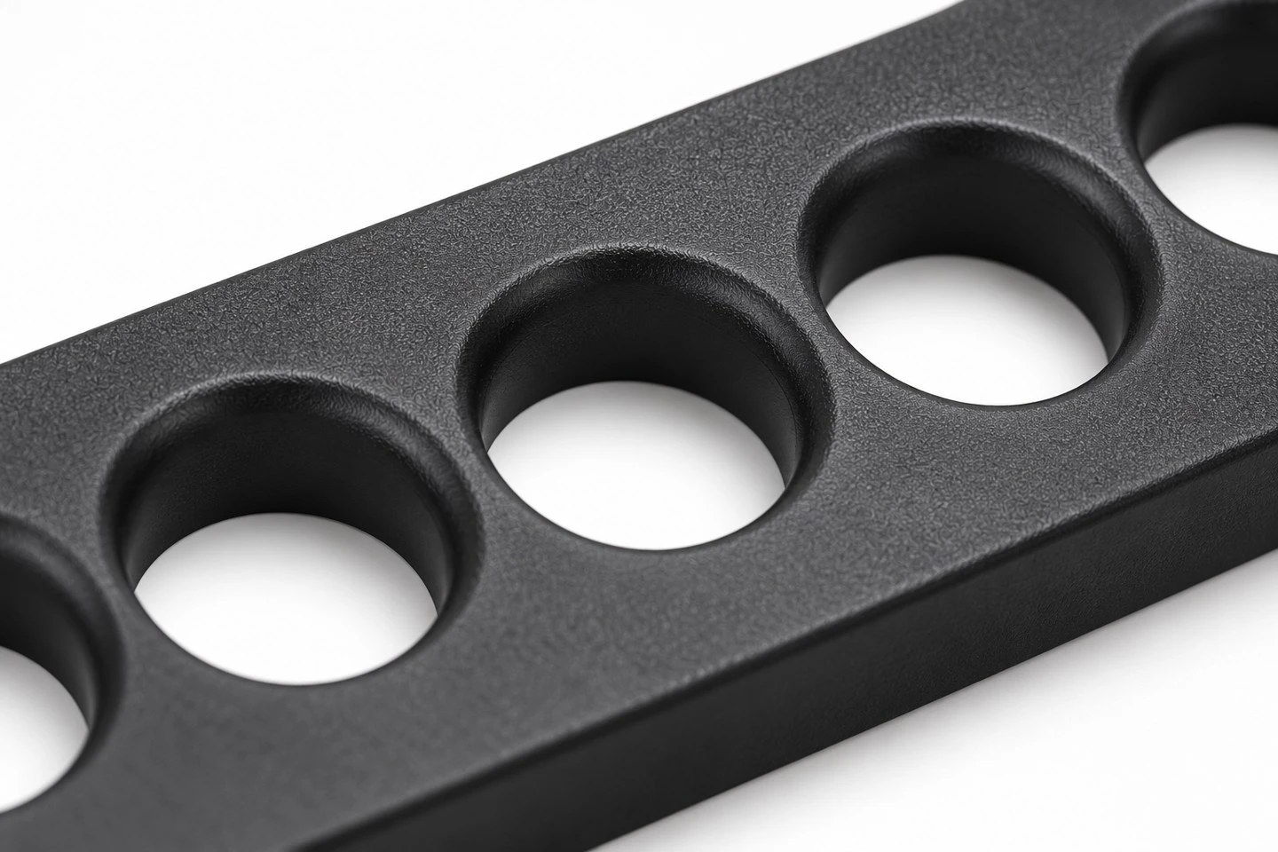 product-1-1 Custom molded plastic cable guide plate showing radiused cable passages and mounting holes