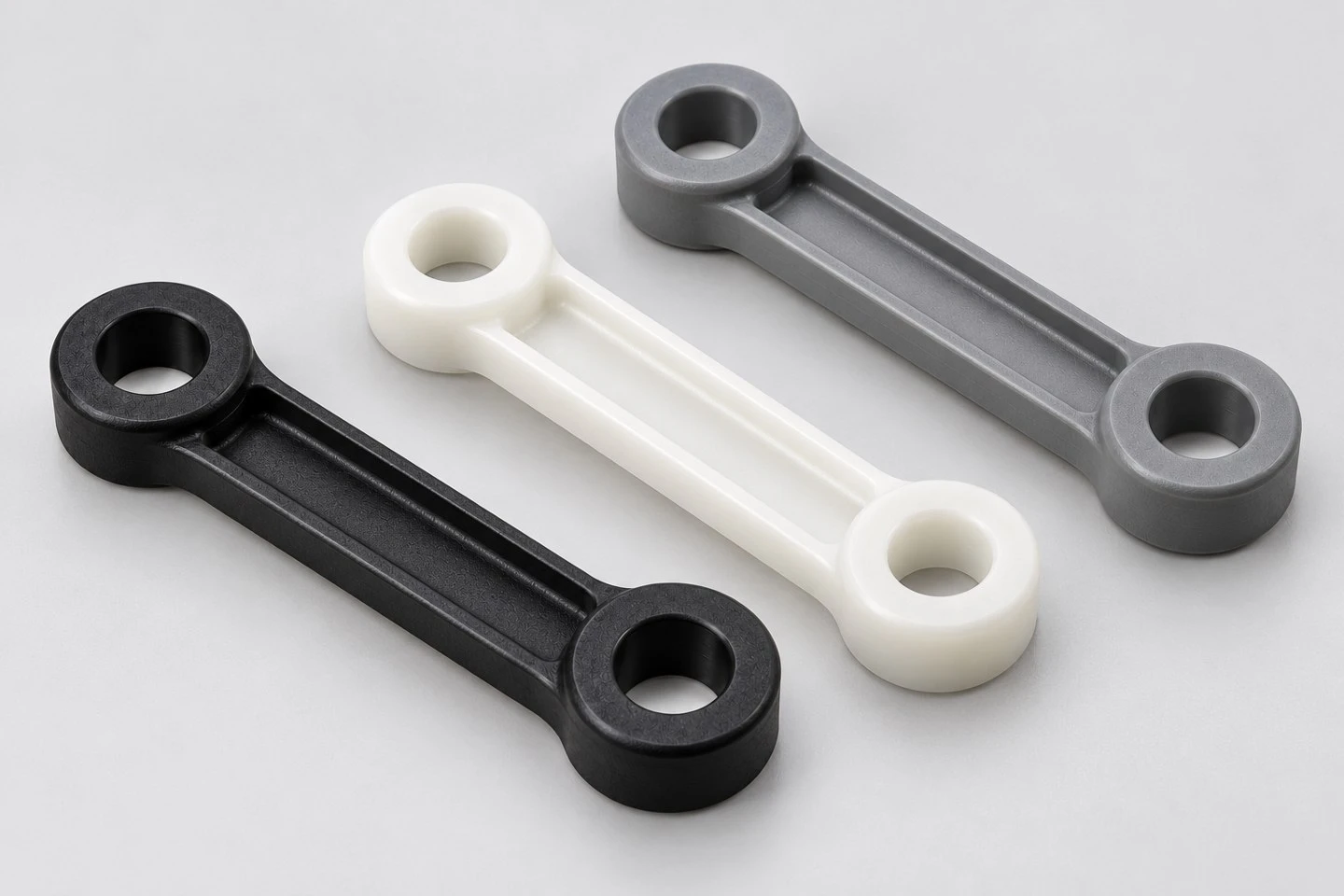 Black natural white and gray custom injection molded plastic linkage arm concepts