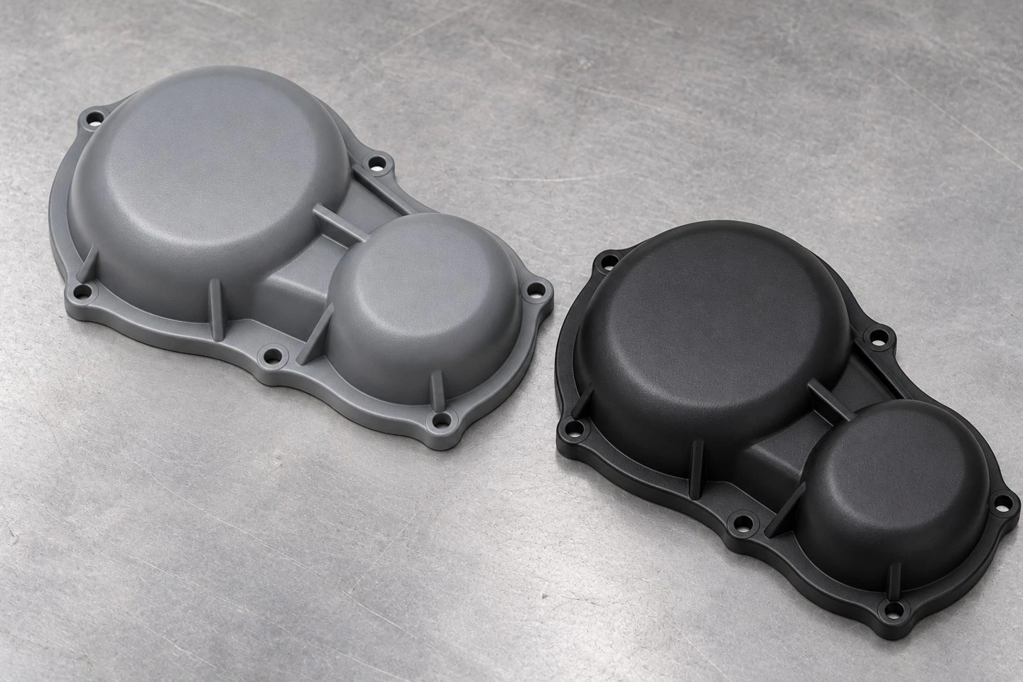 Custom molded plastic gearbox cover concepts in industrial gray and black finishes