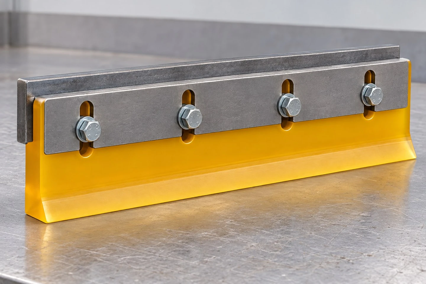 product-1-1 Illustrative polyurethane scraper blade secured in a metal clamping holder to explain the custom mounting region