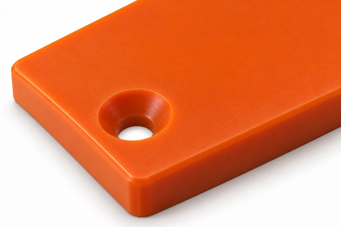 product-1-1 Custom polyurethane chute liner detail showing a recessed mounting hole and the flat wear surface