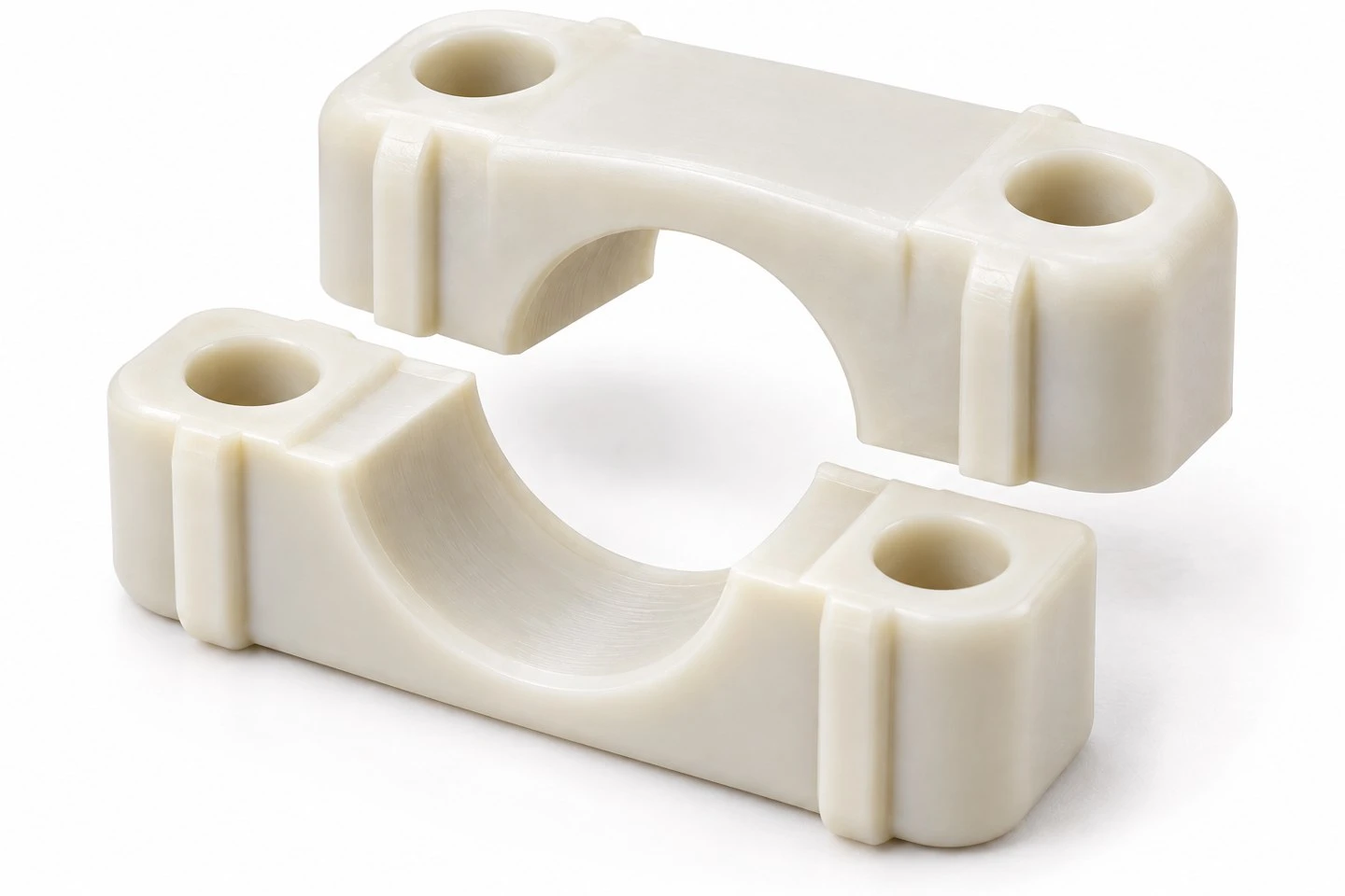 product-1-1 Separated custom injection molded nylon pipe clamp halves showing the semicircular pipe channel and mounting features