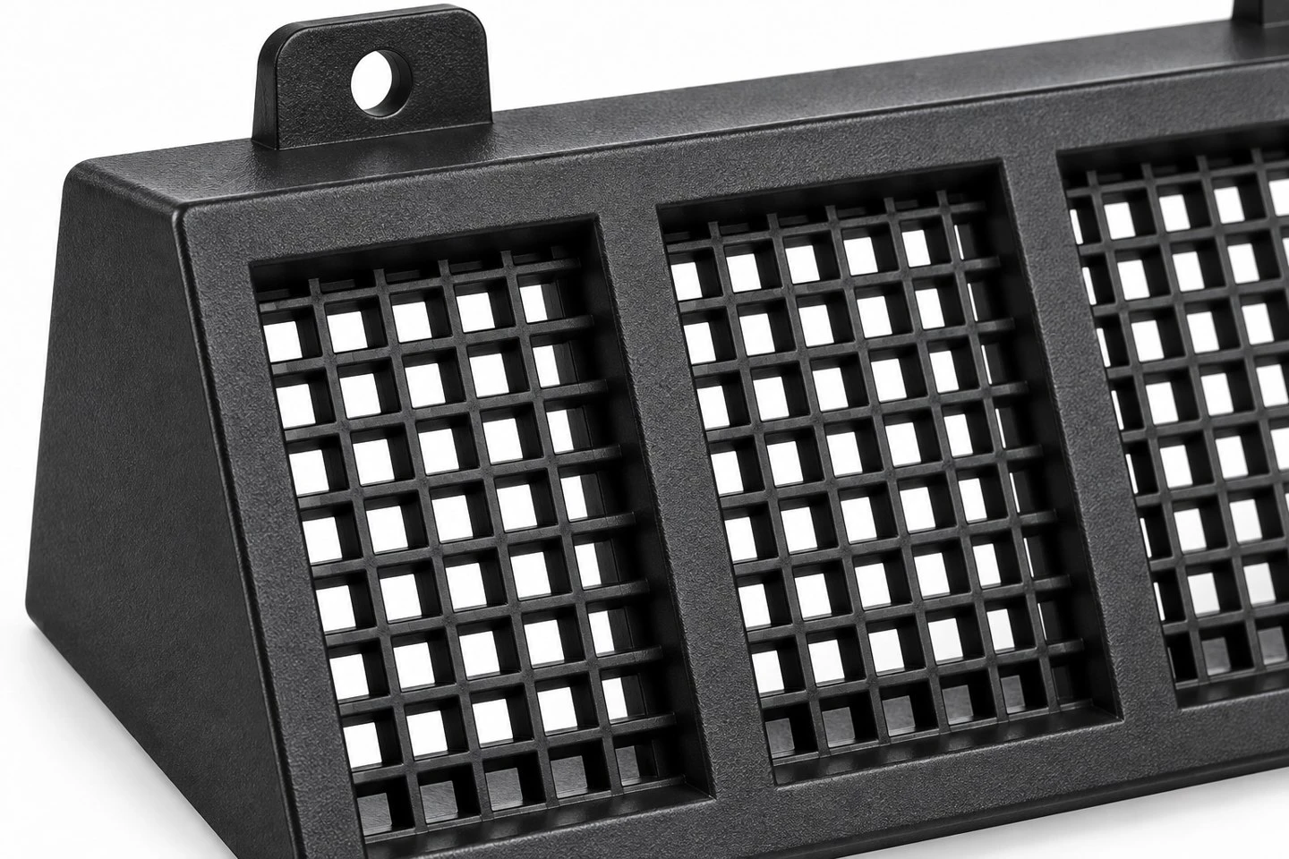 product-1-1 Close view of a custom molded plastic vent grille showing open lattice fields and reinforcing members