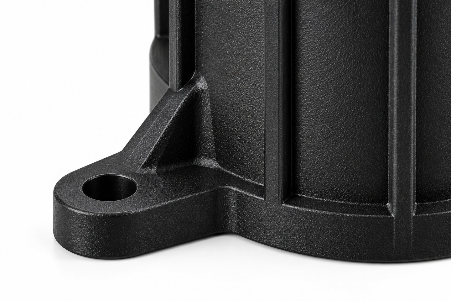 product-1-1 Close view of a gusseted mounting ear and bolt hole on a custom ribbed nylon housing