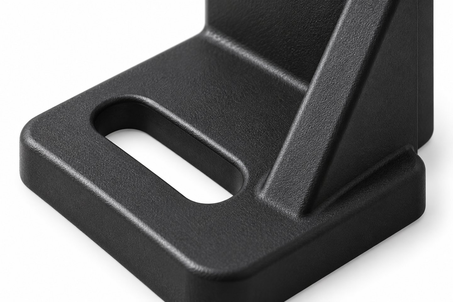 Close view of a slotted base fixing and reinforcing gusset on a custom molded sensor bracket