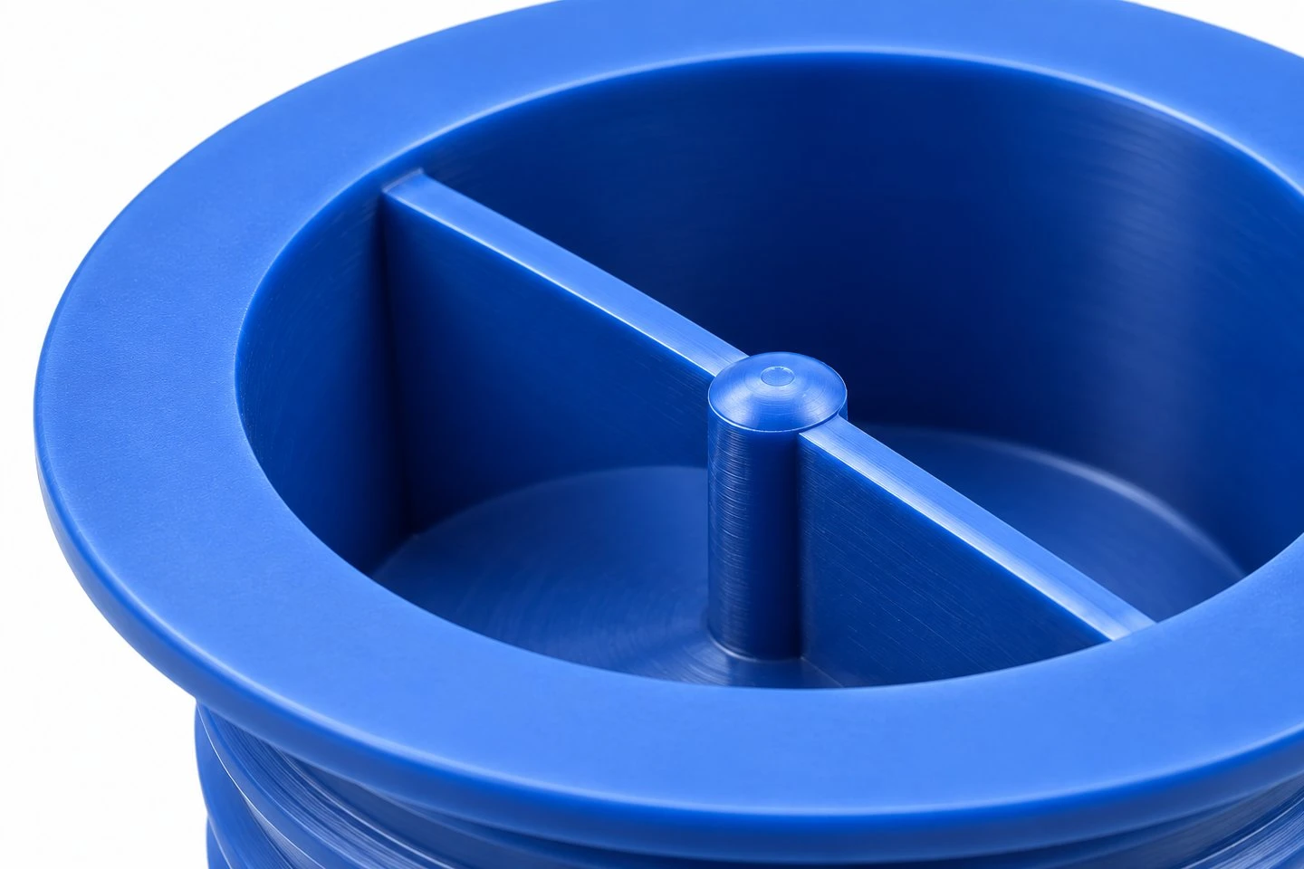 product-1-1 Close view of the flange and recessed diametral grip bar on a blue custom plastic protection plug