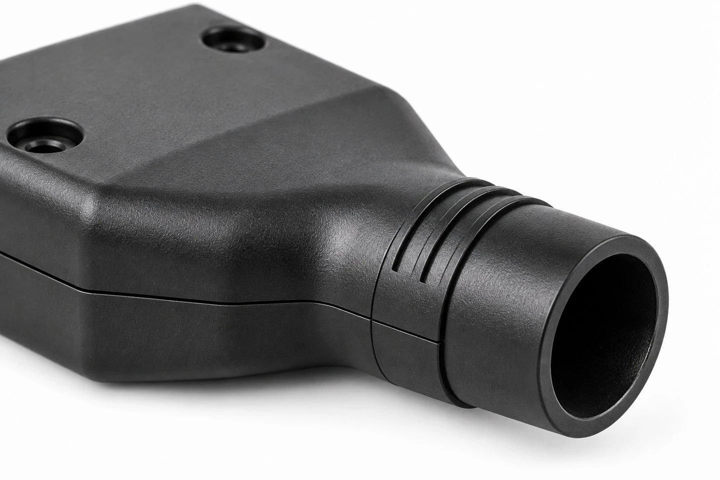 Circular cable exit bore and molded neck ribs on a custom two-piece plastic connector backshell