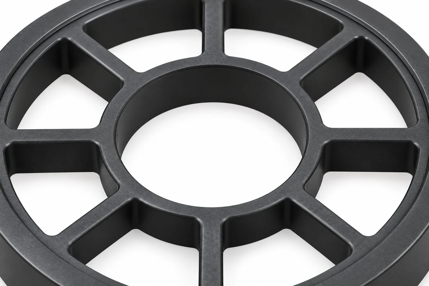 Center opening and eight radial spokes of a custom dark polypropylene support ring concept